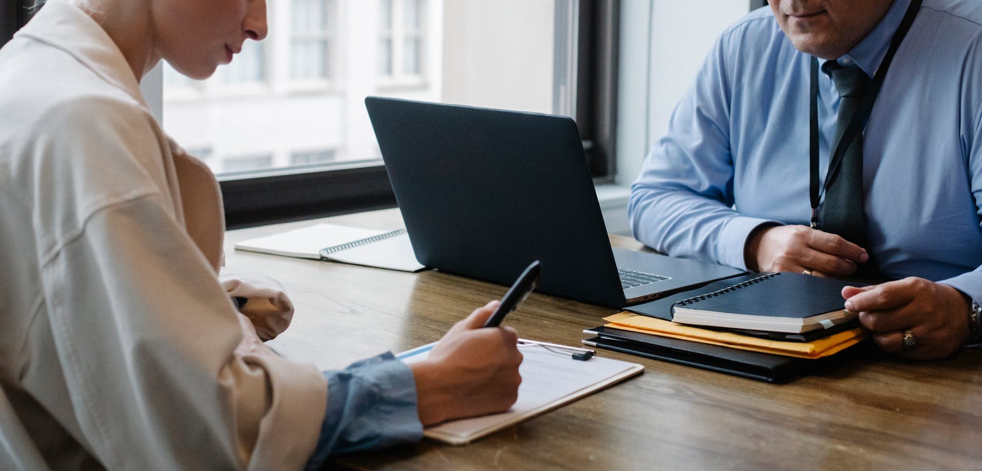 Business professionals reviewing documents at a desk